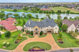 an aerial view of a large home in the suburbs