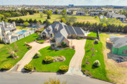an aerial view of a large home in the suburbs