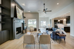 real estate photo of a living room filled with furniture and a fire place