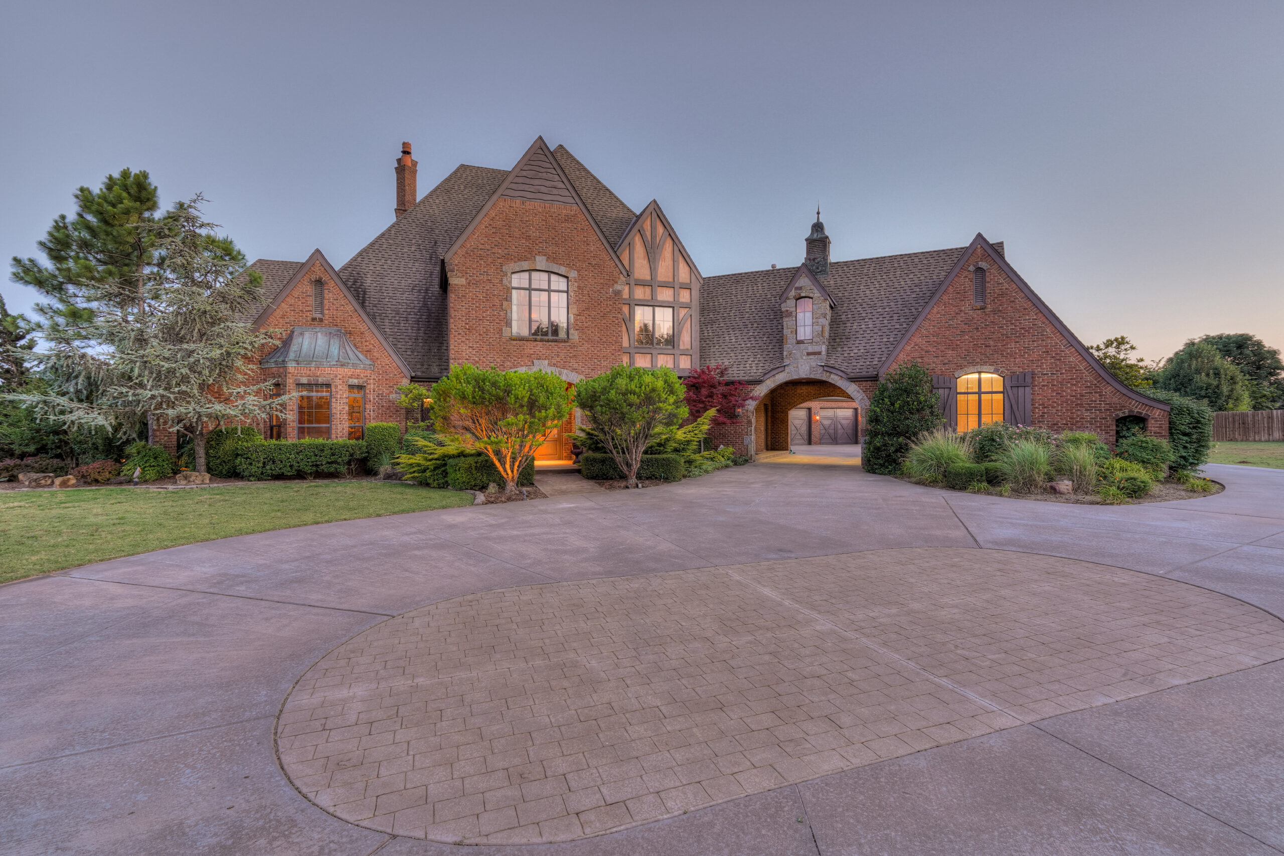 a large brick house with a circular driveway