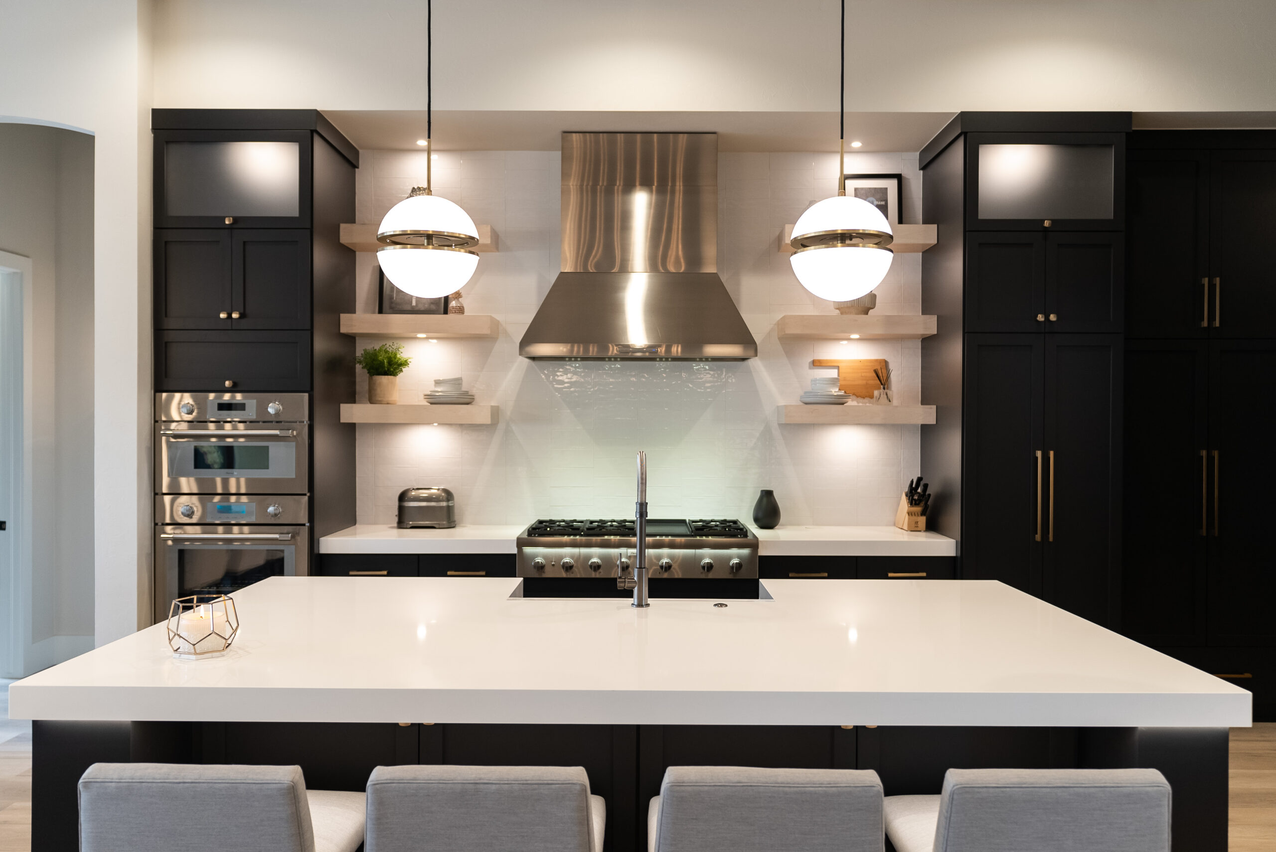 a kitchen with a large white counter top